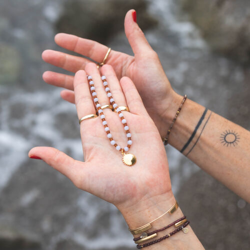 Naszyjnik ze słońcem na brązowych i błękitnych kamieniach