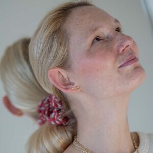 Złote kolczyki asymetryczne z diamentami - zdjęcie 1